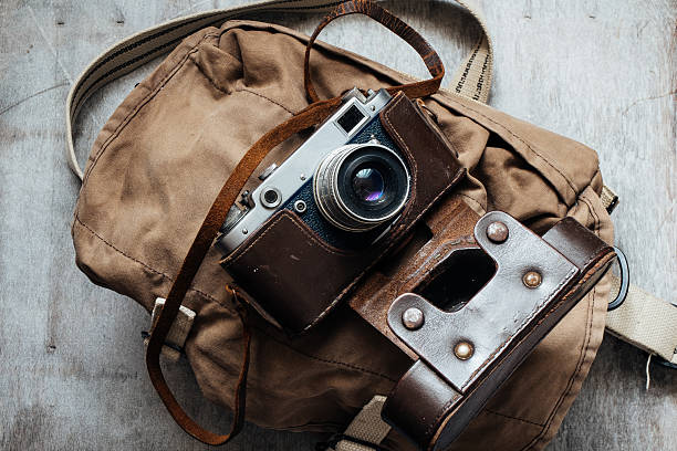 istock Old camera in bag, vintage photo grunge design component 472254774