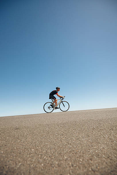 istock Athlete training for cycling event of triathlon 472257870