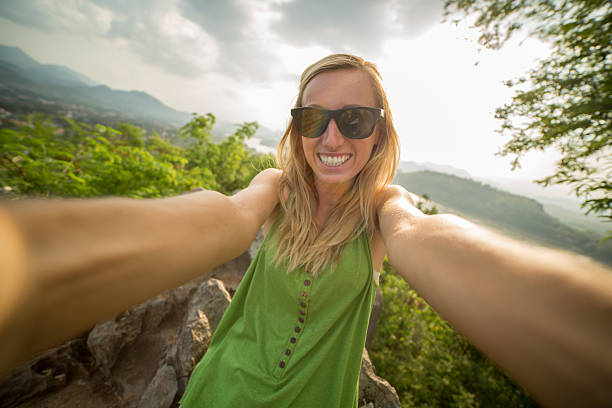 istock Woman takes selfie on mountain top 472257910