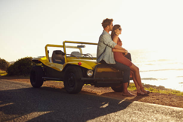 istock Couple enjoying the beach view 472258000