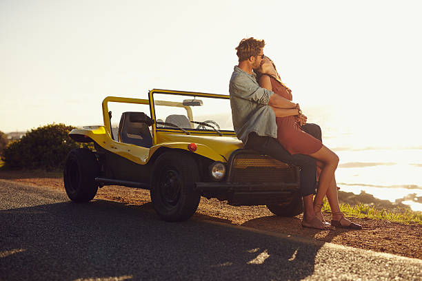 istock Couple on road trip sharing a romantic kissing 472258004