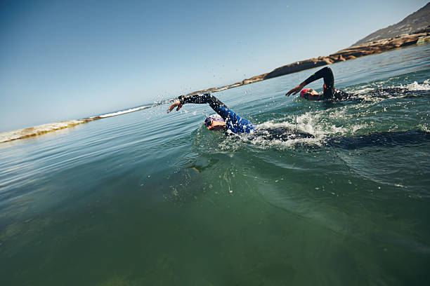 Athletes swimming on triathletic competition