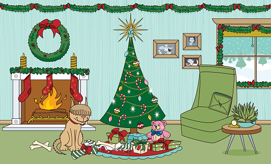 A dog opening his Christmas presents in front of the tree and fireplace.