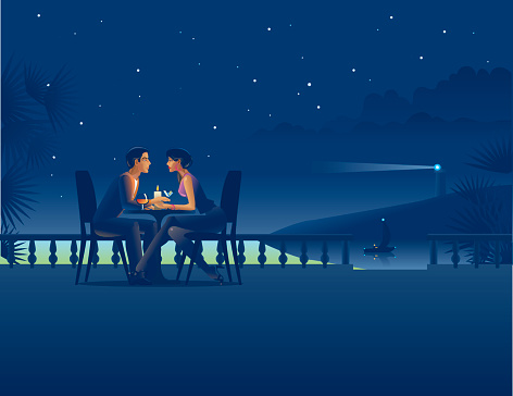 Couple in night coast cafe.