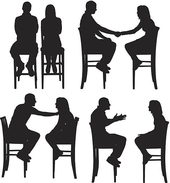 istock Man and woman sitting on tall chairs 472280755