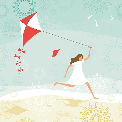 Summer scene with girl flying a kite on the beach.