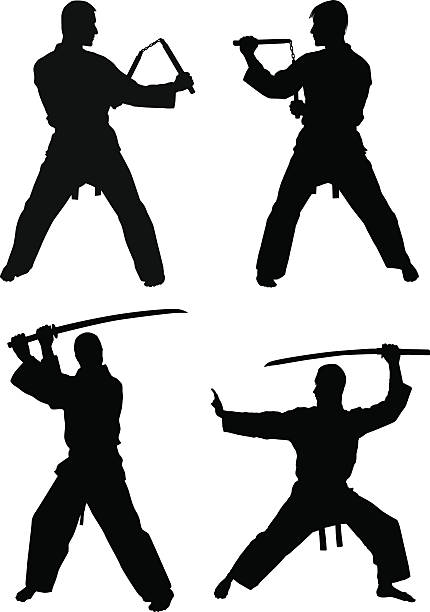 Martial Arts Silhouettes Four silhouettes of martial artists in fighting stances. Two sword fighter silhouettes and two nunchuck martial arts figures are included. The supporting files include individual AI and PNG files of each image. nunchaku silhouette stock illustrations