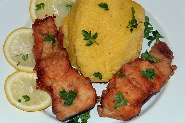 istock Fried fish with polenta and garlic sauce 472287756