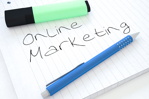 Online Marketing - handwritten text in a notebook on a desk - 3d render illustration.