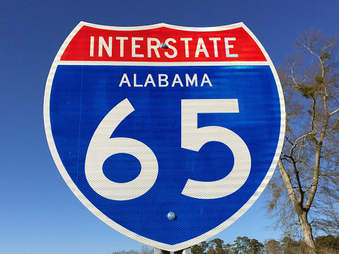 Highway sign for I-65 in Alabama.  Interstate I-65 runs from north to south throughout the state of Alabama connecting most major cities.