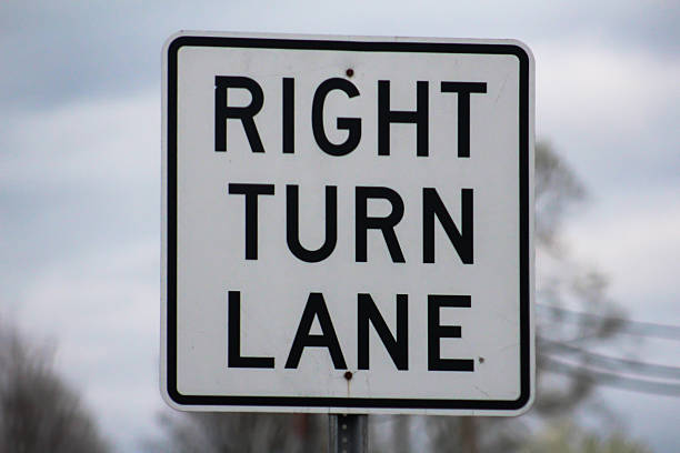 istock Right Turn Lane Sign - Stock Image 472297624