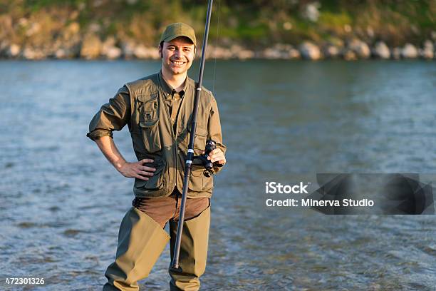 Young Fisherman At The River Stock Photo - Download Image Now - 2015, Activity, Adult