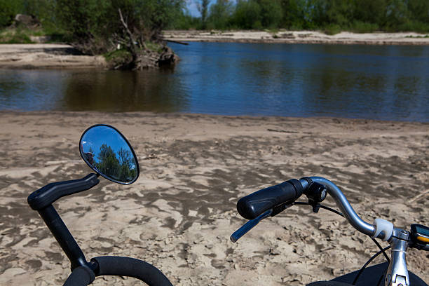 Bicycles on  sandy bank of the river