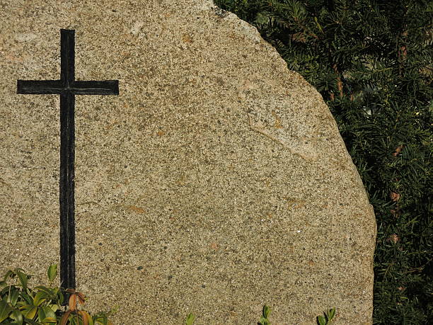 istock Black cross on granite background tombstone 472304556