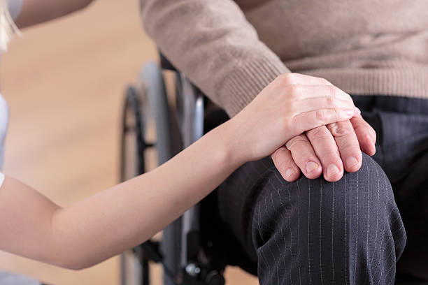 istock Man sitting on a wheelchair 472305160