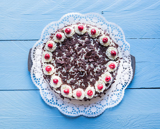 istock Black Forest cake on blue wood 472305642