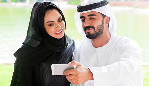 istock Traditional Emirati young family taking a selfie 472310924