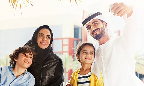 istock Traditional Emirati young family taking a selfie 472310926