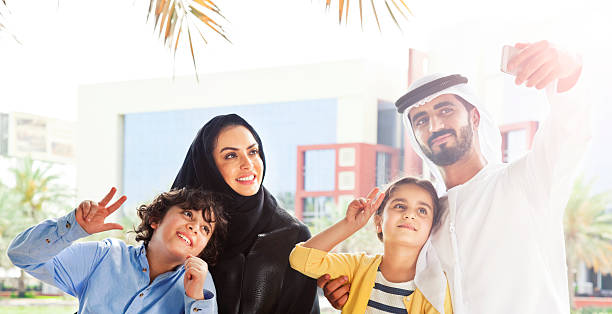 istock Traditional Emirati young family taking a selfie 472310928