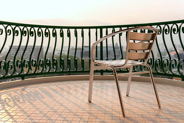 istock Aluminium chair on balcony 472312458