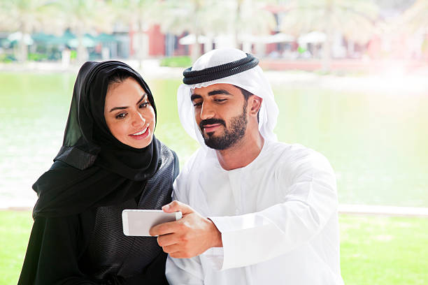 istock Traditional Emirati young family taking a selfie 472314934