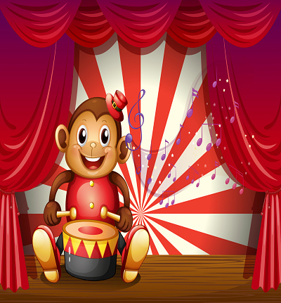Monkey playing with a musical instrument at the stage