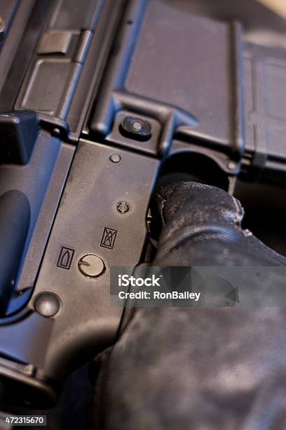 Ar15 Black Gloves Finger On Trigger Stock Photo - Download Image Now - 2015, AR-15, American Culture