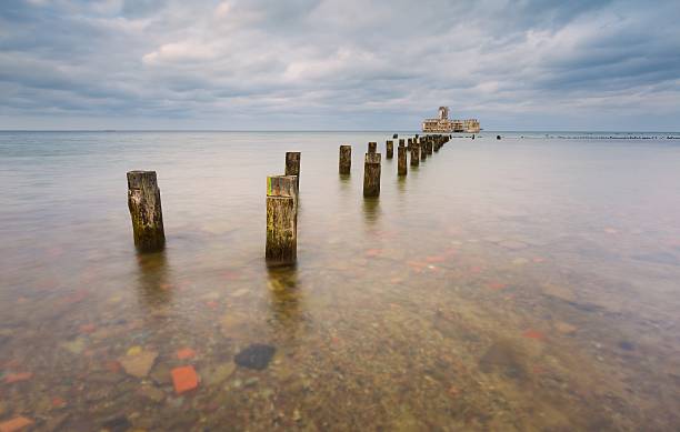 istock Beautiful view on Baltic sandy coast with old military buildings 472316202