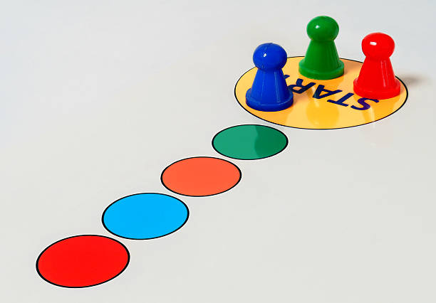 Three playing pieces on a winners podium