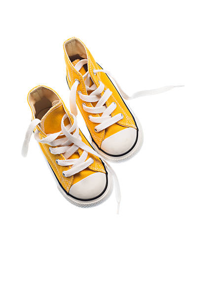 istock Baby sneakers closeup isolated on white 472316378