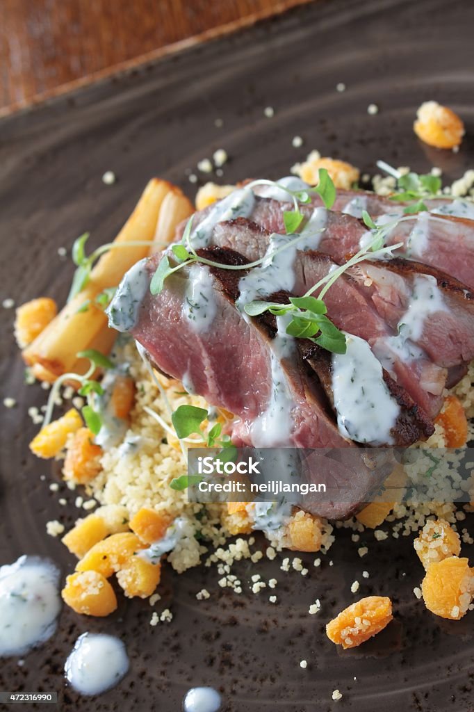lamb with couscous plated meal lamb with couscous plated meallamb with couscous plated meal 2015 Stock Photo