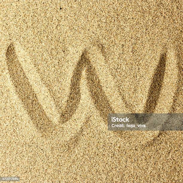 W Handwriting In The Sand Stock Photo - Download Image Now - 2015, Alphabet, Beach