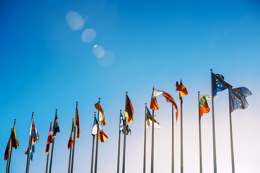 Banderas de la Unión Europea contra el cielo azul  photo