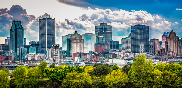 Beautiful Montreal skyline in sunny day with lots of clouds on the sky.