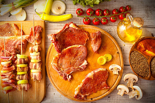 high quality, organically-raised raw beef chunks on a grill for cooking. Concept of Slaughterhouse and Butcher's shop.