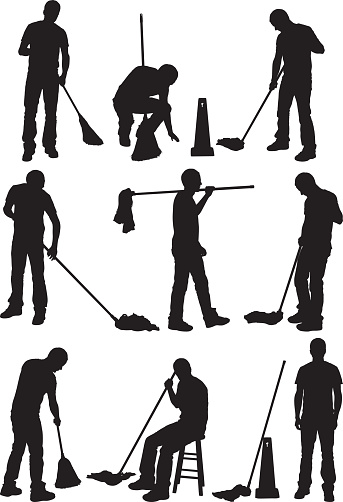 Silhouette of people cleaning the floor