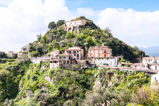 Capuchins Monastery and houses on top of calvario mount in town Savoca in Sicily, Italy
