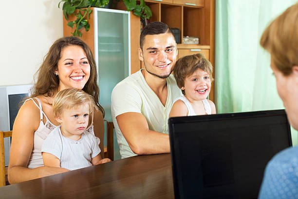 istock social worker with a young family 472323442