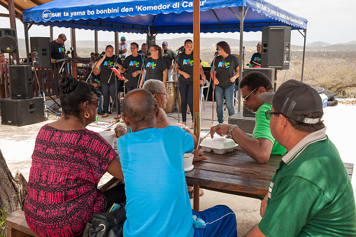 Rincon, Bonaire, Caribbean -  May 2, 2015: People listening to the local band at Cultural Market in Mangazina di Rei