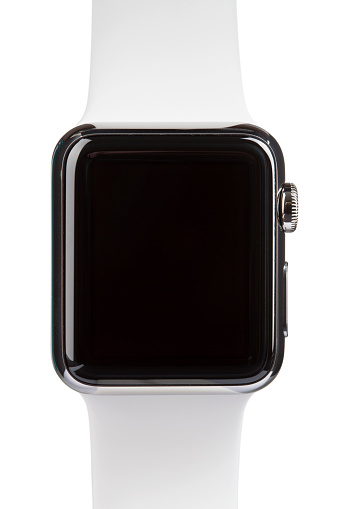 Belen, New Mexico, USA - May 3, 2015: A 38mm stainless steel Apple Watch with white sports band. The Apple Watch became available April 24, 2015, bringing a new way to receive information at a glance, using apps designed specifically for the wrist.