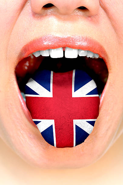 istock Woman With British Flag On Her Tongue 472327690