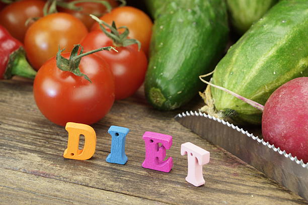 istock Sign Diet Made From Wood Letters And Fresh Local Vegetables 472328534