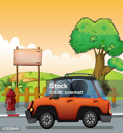 istock Orange car along the street with a wooden signboard 472329491