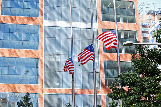 istock American flags flying at half mast 472331590