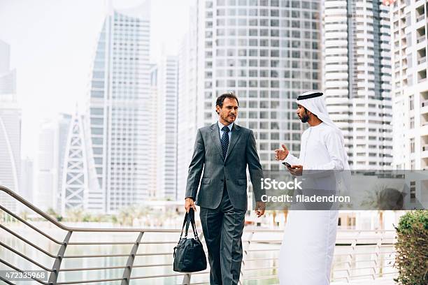 Emirati Man Having Outdoors Business Meeting Stock Photo - Download Image Now - Businessman, United Arab Emirates, Dubai Marina