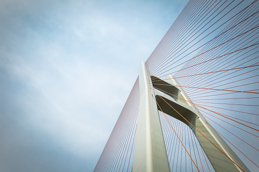 cable-stayed bridge closeup against a cloudy sky