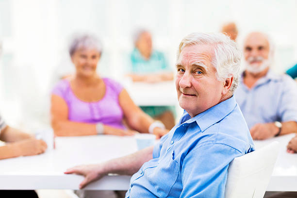 istock Senior man sitting and looking at the camera. 472336844