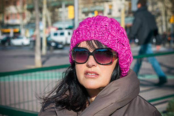 istock woman sitting on a bench 472336888