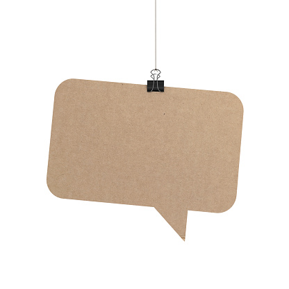 A  3D representation of a speech bubble hanging on a plain white background. The speech bubble is hanging from a binder paper clip that is attached to a piece of string. The bubble has a cardboard texture. The background is pure white. You can add your own message to the speech bubble