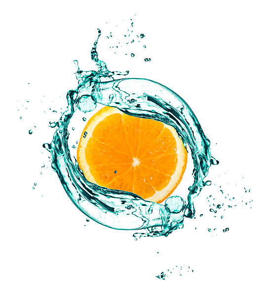 istock orange in spray of water 472342910
